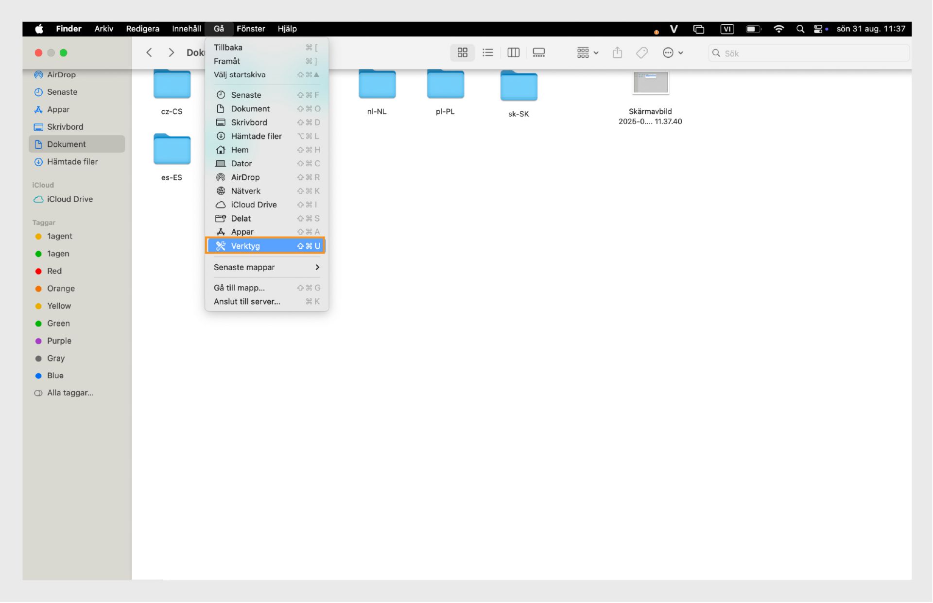 macOS Finder-fönster som markerar mappen Verktygsprogram i vänster sidofält.