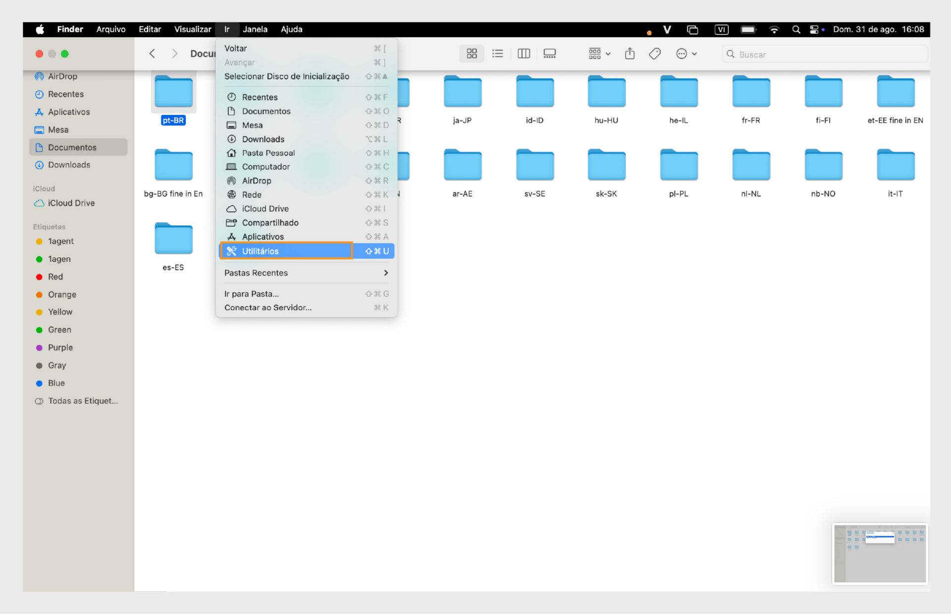 Janela do Finder do macOS destacando a pasta Utilitários na barra lateral esquerda.