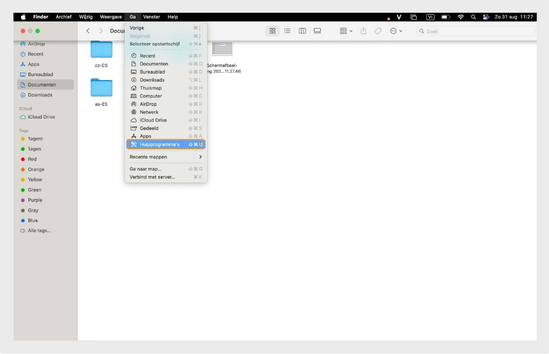 macOS Finder-venster met de map Hulpprogramma's gemarkeerd in de linkerzijbalk.