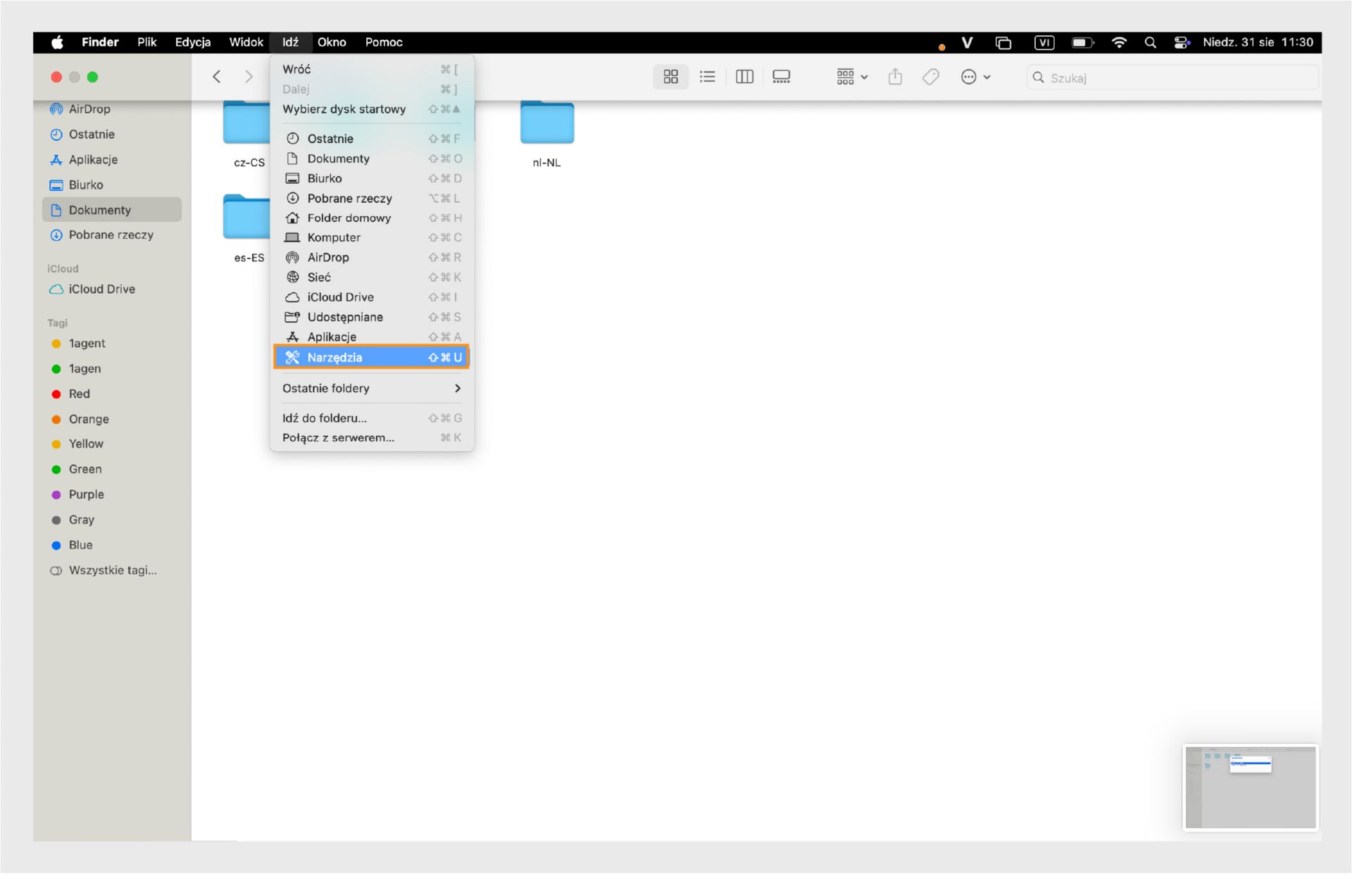 Okno Findera macOS z wyróżnionym folderem Narzędzia w lewym pasku bocznym.
