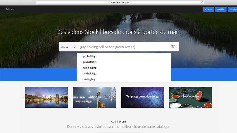 Dans une capture d'écran d'un navigateur Safari, page de recherche de vidéos d'Adobe Stock avec « guy holding cell phone green screen » saisi dans la barre de recherche