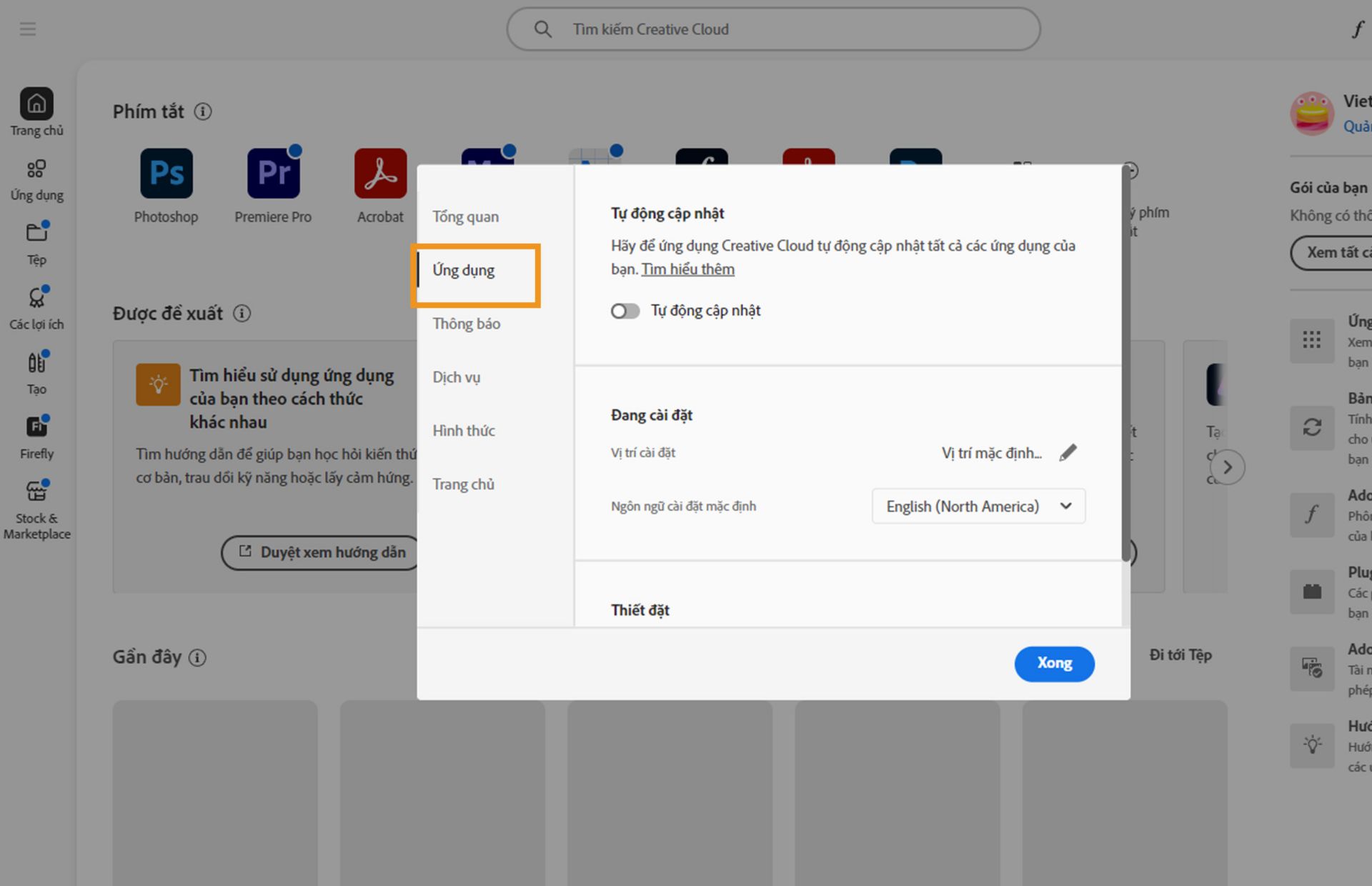 Bảng lựa chọn ưu tiên của Adobe Creative Cloud đang mở trên tab &quot;Ứng dụng&quot;, hiển thị các tùy chọn tự động cập nhật, vị trí cài đặt và mức sử dụng băng thông.