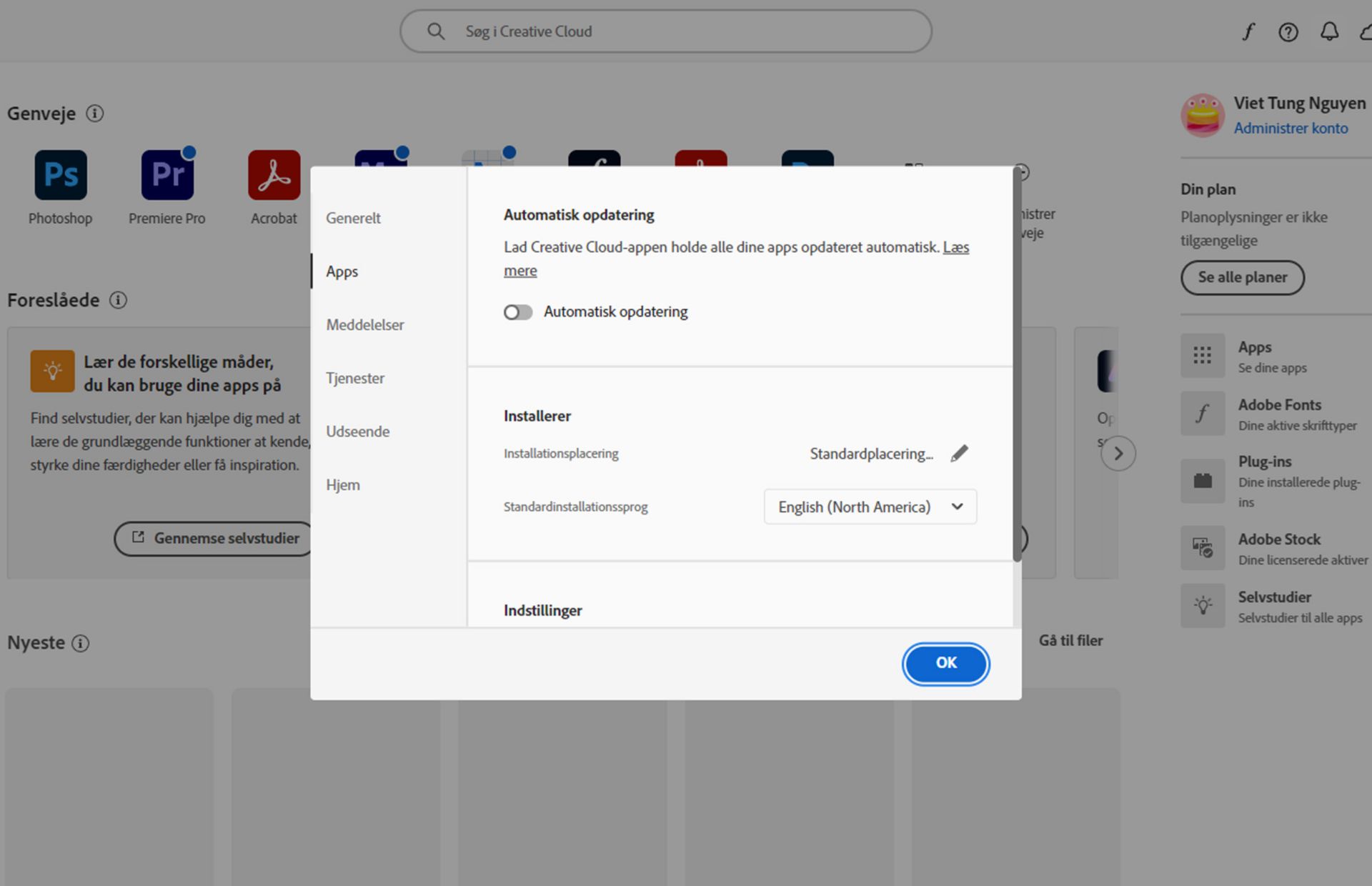 Panelet Præferencer, der er åbent i Adobe Creative Cloud på fanen &quot;Sprog&quot; og fremhæver muligheden for at indstille standardsproget for appinstallation.