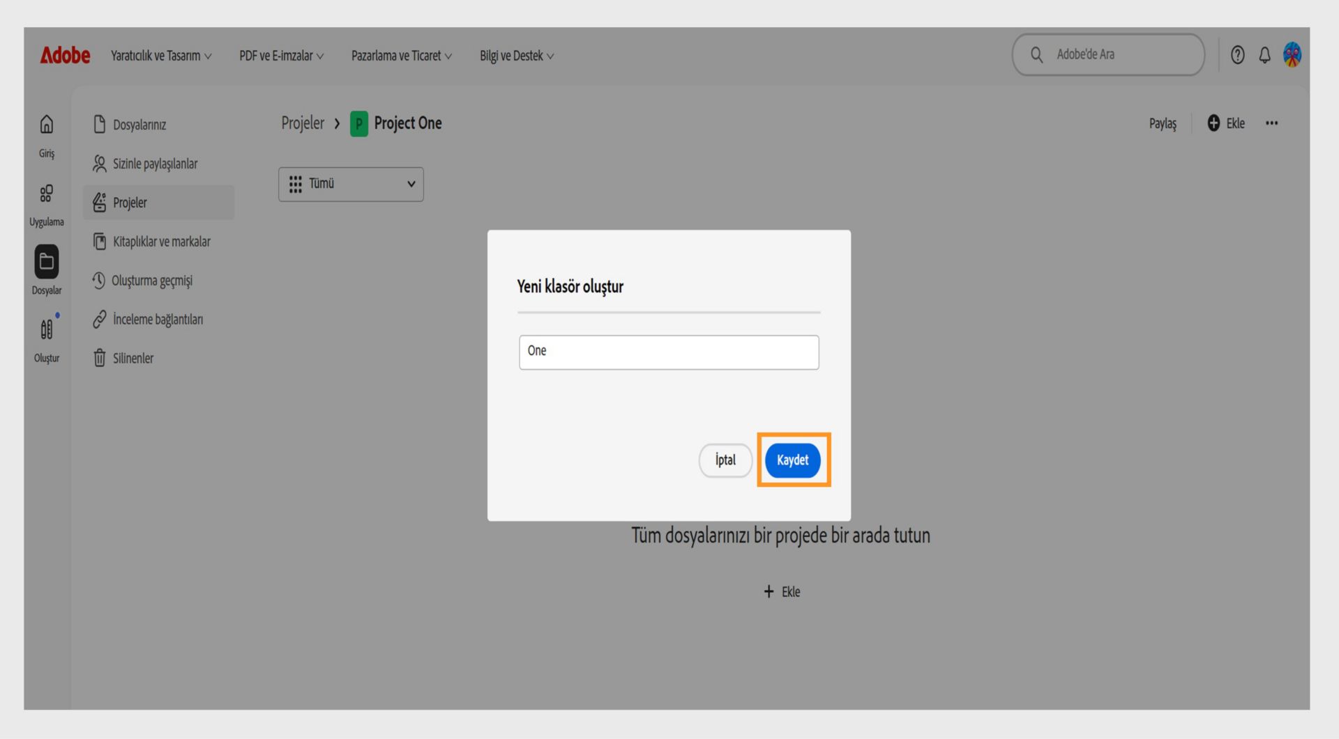 Adobe web arayüzünde "Yeni klasör oluştur" başlıklı bir iletişim kutusu gösteriliyor; klasör adını girmek için bir metin alanı ve iptal etme veya kaydetme seçenekleri bulunuyor.