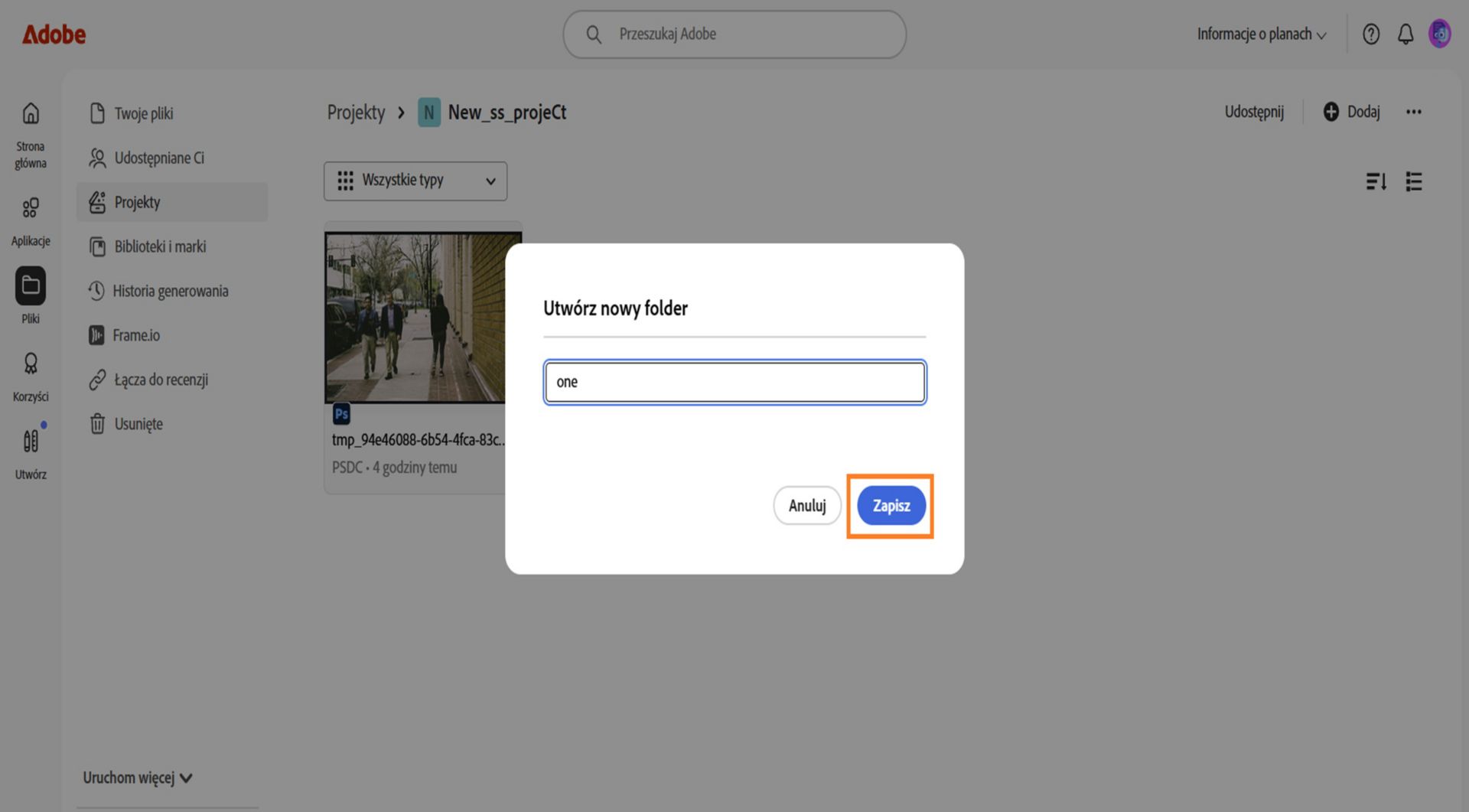 Interfejs internetowy Adobe pokazujący okno dialogowe z etykietą "Utwórz nowy folder", z polem tekstowym do wprowadzenia nazwy folderu oraz options do anulowania lub zapisania.