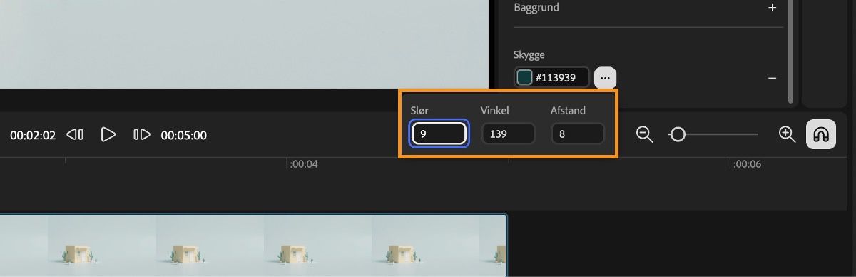 Tekstlaget er markeret i tidslinjen, og der er tekstegenskaber, du kan redigere. De fremhævede egenskaber er Skygge og dens sløring, vinkel og afstand.