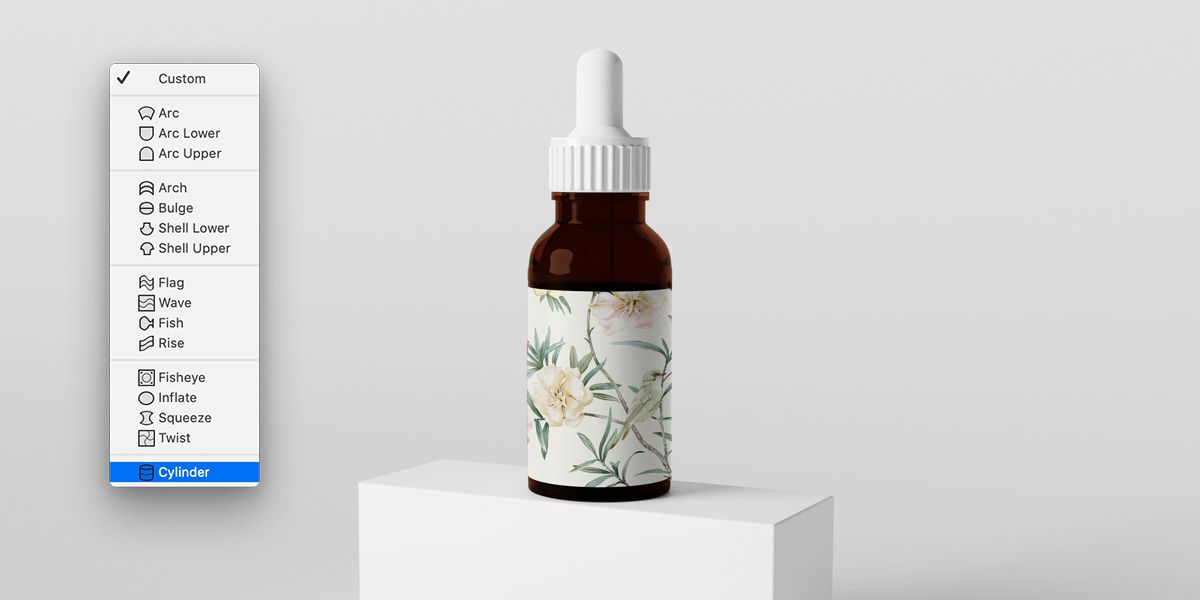 เมนูดรอปดาวน์ของการบิดใน Photoshop ที่เลือกทรงกระบอกเอาไว้อยู่ แสดงฉลากลายดอกไม้ที่พันรอบขวดหลอดหยดขวดพร้อมหลอดหยด